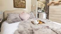 Sink into the luxurious king-size bed.
