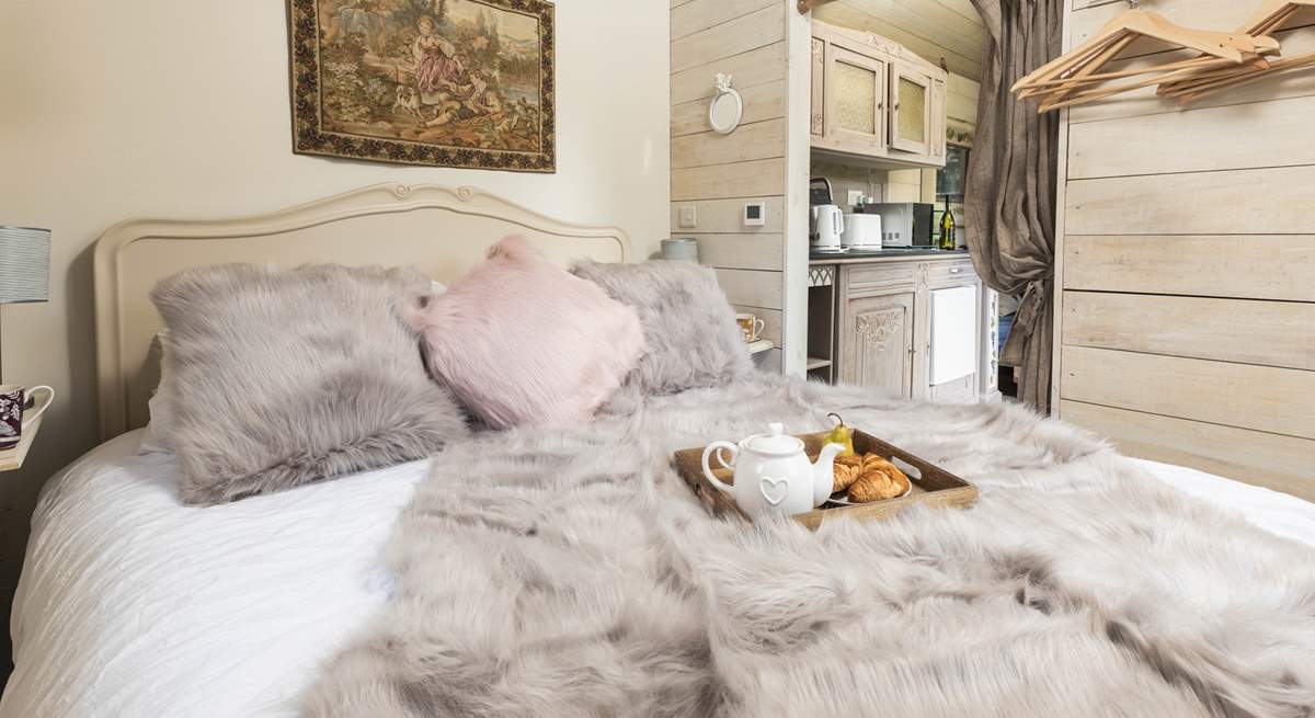 Sink into the luxurious king-size bed.