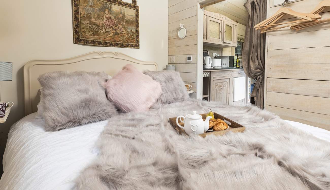 Sink into the luxurious king-size bed.