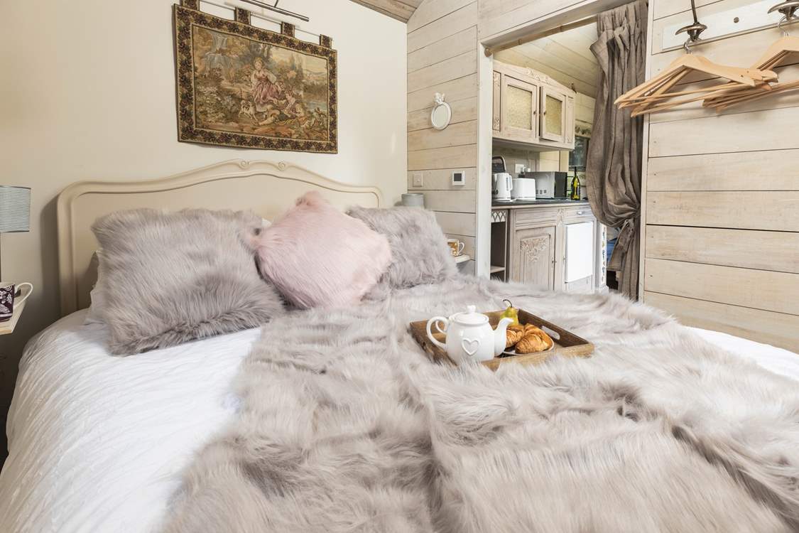 Sink into the luxurious king-size bed.