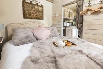 Sink into the luxurious king-size bed.