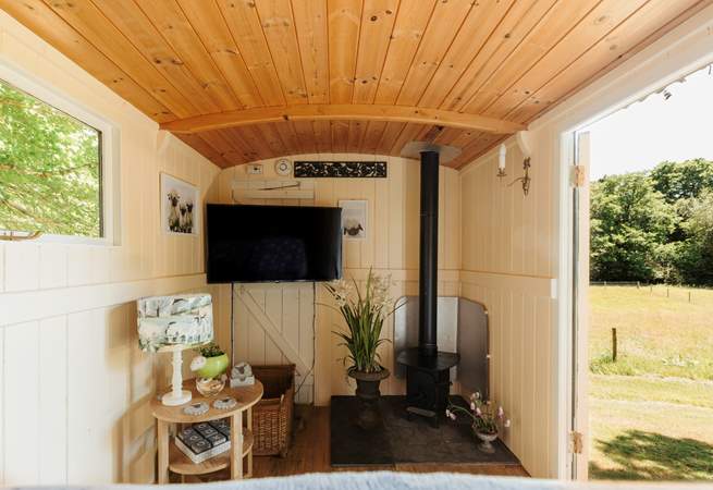 In here, you'll find another wood burner and a smart TV. 