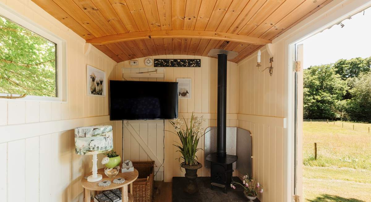 In here, you'll find another wood burner and a smart TV. 
