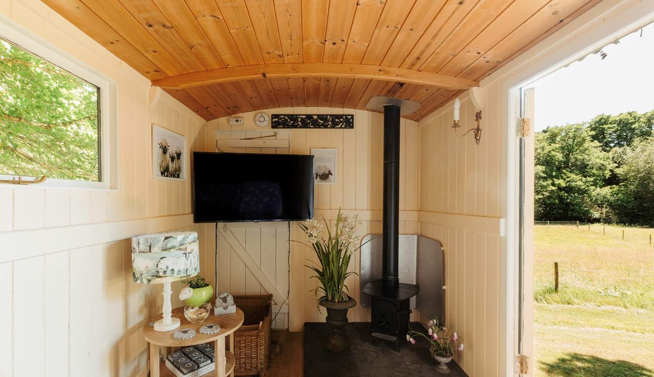 In here, you'll find another wood burner and a smart TV. 