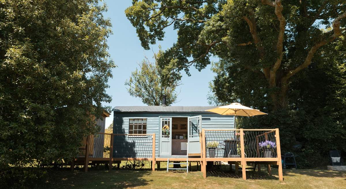 To the left of the hut is where the shower room sits. 