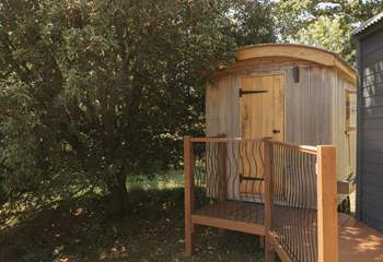 To the left of the hut sits the shower hut, a smaller hut to freshen up in. 