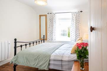 The lovely main bedroom on the first floor overlooks the front of the property.
