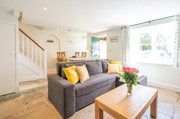 The sitting/dining room is very light, and you can sit back and relax with the added bonus of a wood-burner for those colder evenings.