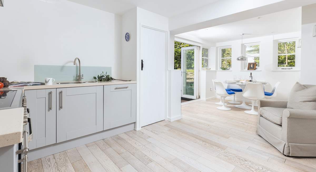 The lovely and light kitchen/diner space with doors out to the garden.