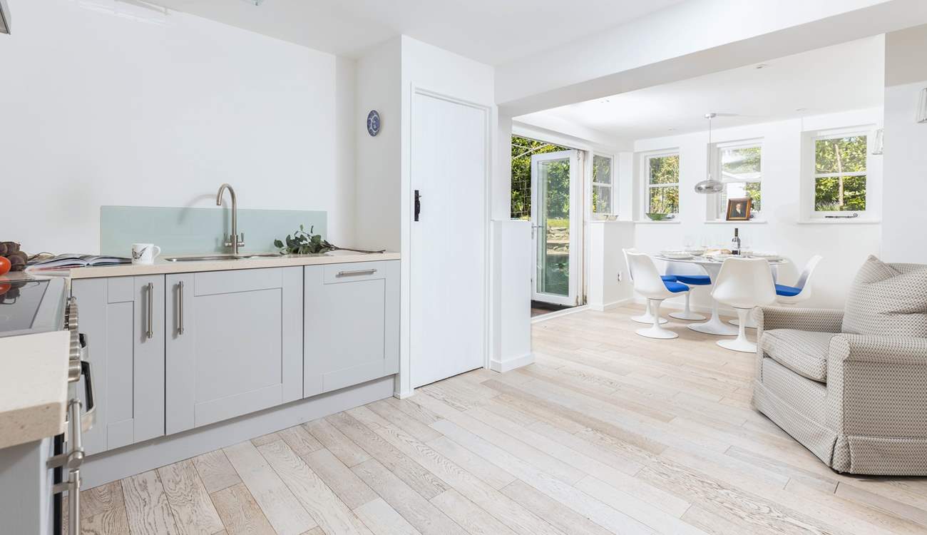 The lovely and light kitchen/diner space with doors out to the garden.