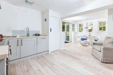 The lovely and light kitchen/diner space with doors out to the garden.