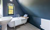 The simply wonderful family bathroom with a fabulous bath. Please note the sloping ceiling in this room. - Thumbnail Image