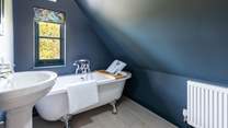 The simply wonderful family bathroom with a fabulous bath. Please note the sloping ceiling in this room.