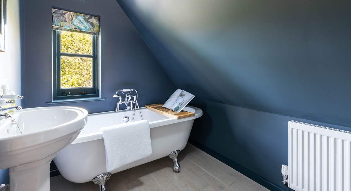 The simply wonderful family bathroom with a fabulous bath. Please note the sloping ceiling in this room.