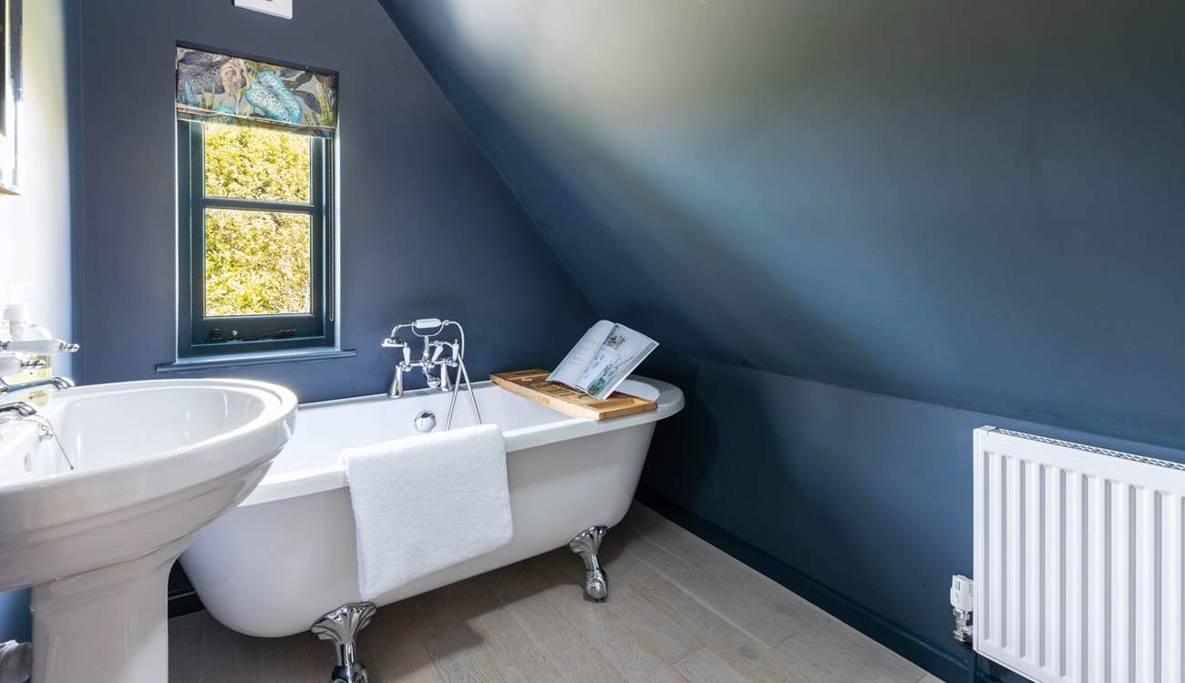The simply wonderful family bathroom with a fabulous bath. Please note the sloping ceiling in this room.