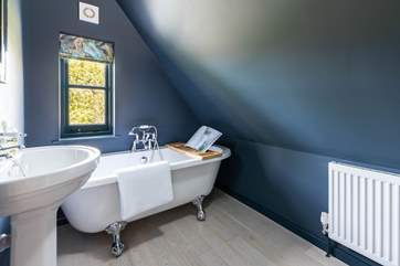 The simply wonderful family bathroom with a fabulous bath. Please note the sloping ceiling in this room.