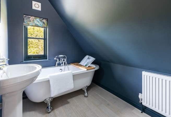 The simply wonderful family bathroom with a fabulous bath. Please note the sloping ceiling in this room.