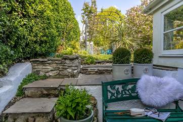 Step up to the main garden after a morning coffee on the bench.
