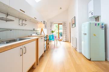 Doors lead out onto the rear decking and enclosed garden.