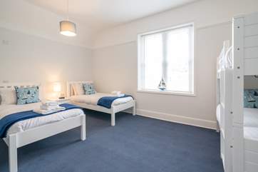 The third bedroom on the second floor is ideal for the younger ones offering twin beds and bunk-beds.