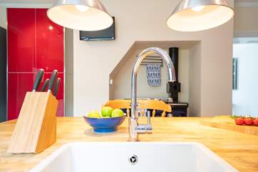 The modern style kitchen has the benefit of an Aga cooker.