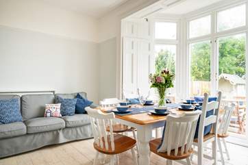 This spacious room has doors opening out onto the garden, ideal for family meals on those sunny days.