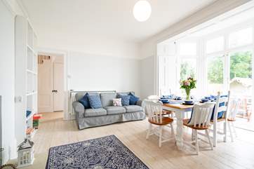 The spacious dining-room on the ground floor has lovely views across the garden.