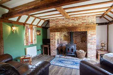 The living-room is so cosy with its inglenook fireplace and wood-burning stove.