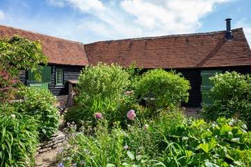 The cottage with the green door on the right is The Byre.