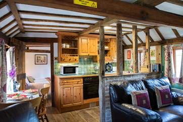 The open plan living area is cosy with lots of gorgeous beams, some low so please mind your head.