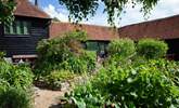 The paths in the courtyard lead to the other cottages so great if you decide to book the other cottages with family or friends. - Thumbnail Image