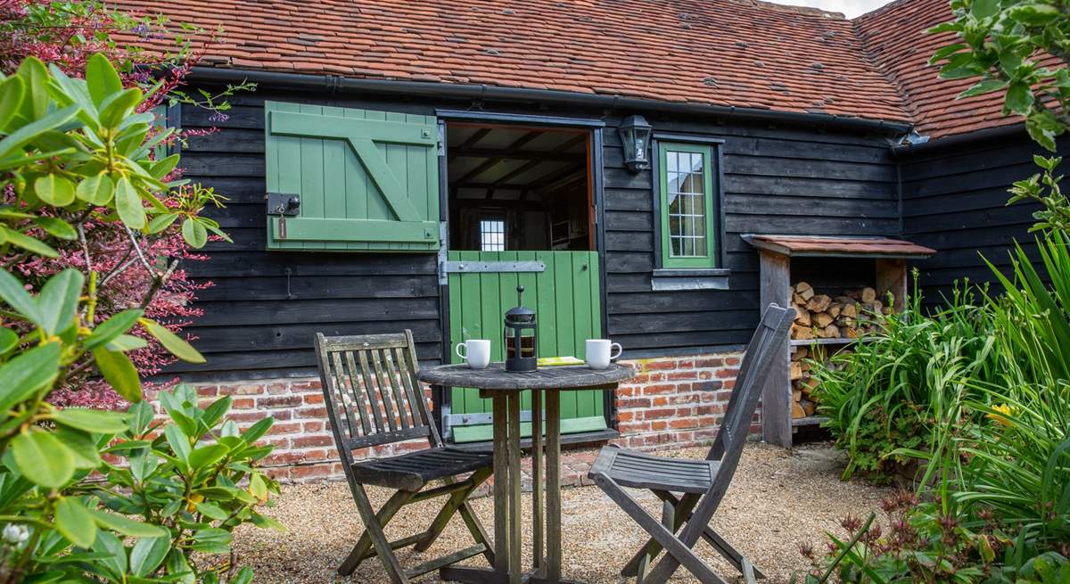 Stable-door onto the courtyard. There are plenty of logs for the wood-burner.