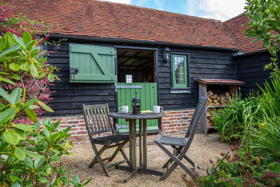 Stable-door onto the courtyard. There are plenty of logs for the wood-burner.