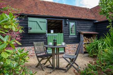 Stable-door onto the courtyard. There are plenty of logs for the wood-burner.