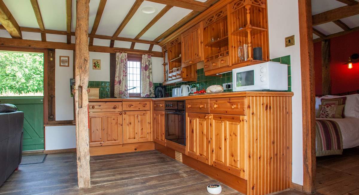 The fully equipped kitchen area. The door on the right leads to the bedroom and the stable-door takes you to an enclosed private garden ideal for those with dogs.