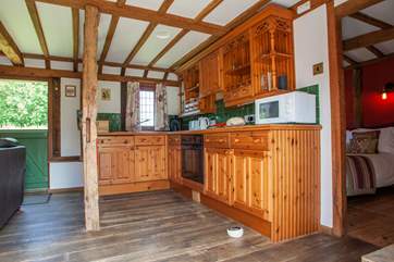 The fully equipped kitchen area. The door on the right leads to the bedroom and the stable-door takes you to an enclosed private garden ideal for those with dogs.