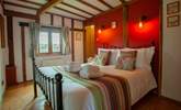 The beautiful beams add to the charm of this lovely ground floor bedroom. - Thumbnail Image