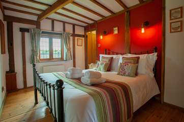The beautiful beams add to the charm of this lovely ground floor bedroom.