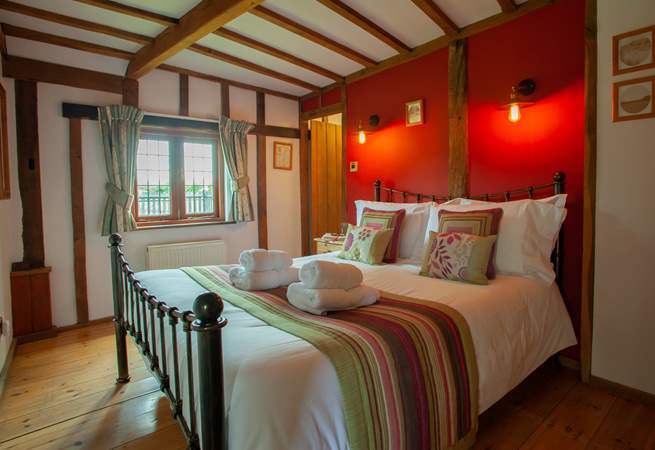 The beautiful beams add to the charm of this lovely ground floor bedroom.