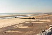 Take a trip to Camber Sands with its picturesque dunes.