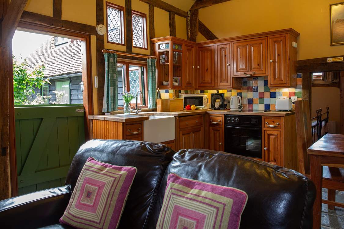 A view of the kitchen area with stable-door to the courtyard garden.