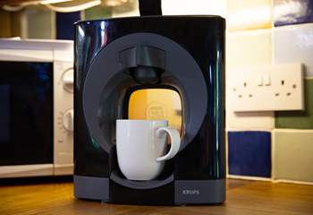 Enjoy a drink from the Dolce Gusto coffee machine.