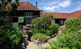 The courtyard is surrounded by pretty plants and gives you the opportunity to chat to fellow guests in the adjoining cottages if you wish. - Thumbnail Image