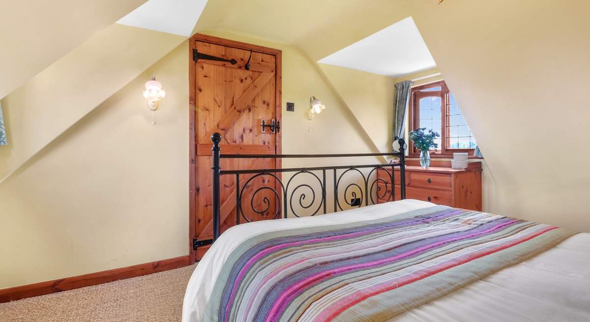 The bedrooms have lots of character with sloping ceilings.