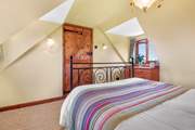 The bedrooms have lots of character with sloping ceilings.