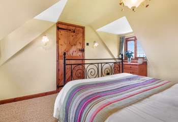 The bedrooms have lots of character with sloping ceilings.