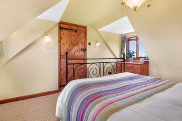 The bedrooms have lots of character with sloping ceilings.