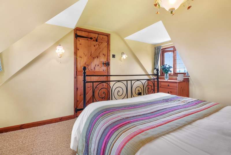 The bedrooms have lots of character with sloping ceilings.