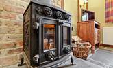 The wood-burner keeps The Coach House cosy. - Thumbnail Image