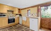 The kitchen with lovely Butler sink and stable-door is complete with a dishwasher, microwave and a Dolce Gusto coffee machine. - Thumbnail Image